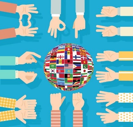 Descripción de la imagen: Bola del mundo con las banderas oficiales de los paises rodeada de brazos diferentes simulando gestos en Lengua de signos.